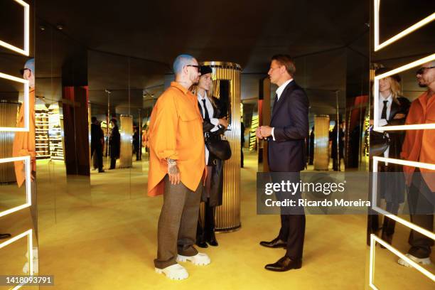 Singer J Balvin and his girlfriend Valentina Ferrer talk with CEO of Tiffany & Co. Anthony Ledru at the event space Casa Bossa in Shopping Cidade...