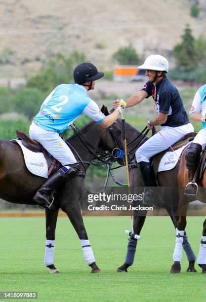 Prince Harry, Duke of Sussex and umpire play polo during the Sentebale ISPS Handa Polo Cup 2022 on August 25, 2022 in Aspen, Colorado.