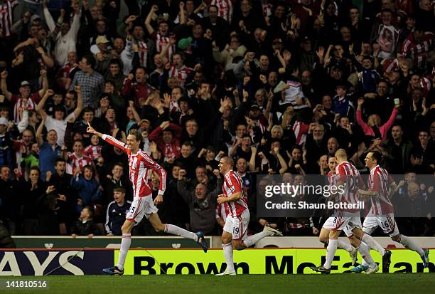 Peter Crouch of Stoke celebrates after scoring the opening goal during the Barclays Premier League match between Stoke City and Manchester City at...