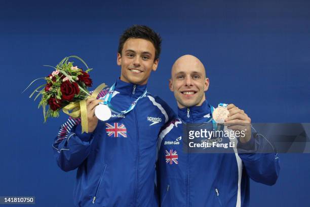Silver medalist Tom Daley and bronze medalist Peter Waterfield of Great Britain pose for photo after the Men's 10m Platform Final during day two of...