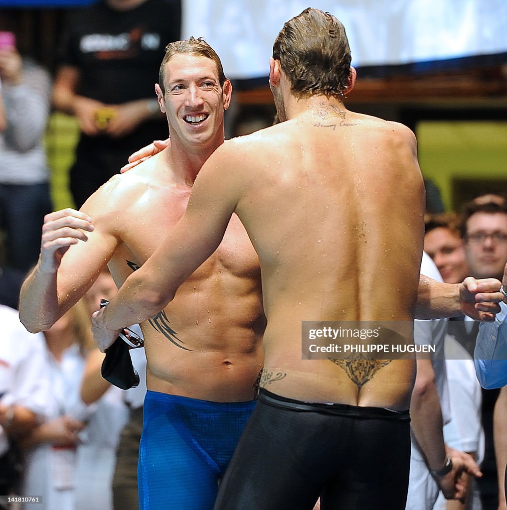 French swimmer Amaury Leveaux (R) is con