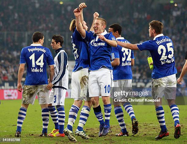 The team of Schalke with Kyriakos Papadopoulos, Christian Fuchs, Lewis Holtby and Klaas-Jan Huntelaar of Schalke celebrates the 2-0 v ictory after...