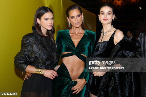 Model Bruna Marquezine, model Izabel Goulart and model Camila Queiroz pose for pictures carpet of Yellow is the New Blue Event organized by Tiffany &...