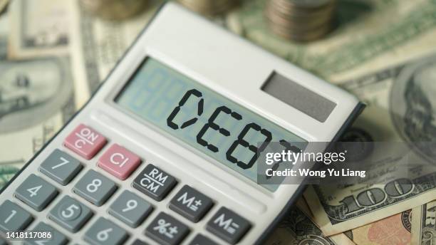 debt , calculator and american dollar with coins, financial concept photo - debt ceiling stock-fotos und bilder