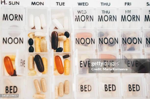 weekly pill organizer. - pill organizer stock pictures, royalty-free photos & images