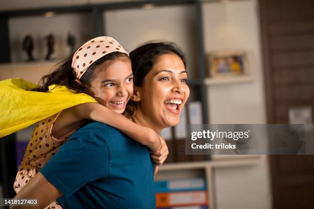girl having fun with her mother at home - indian superhero stock pictures, royalty-free photos & images