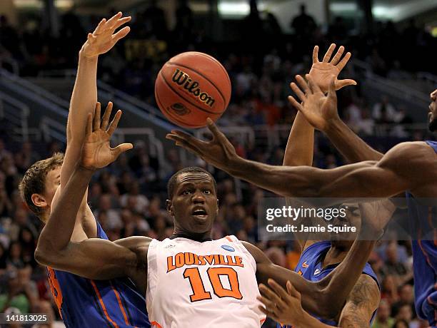 Gorgui Dieng of the Louisville Cardinals goes for the ball along with Erik Murphy of the Florida Gators in the first half during the 2012 NCAA Men's...