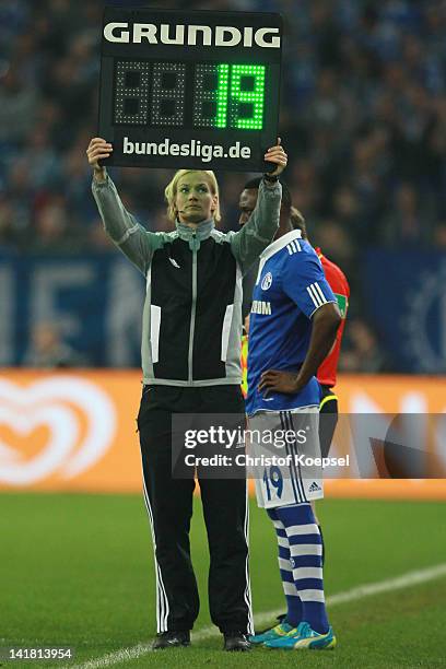 Forth referee Bibiana Steinhaus holds the substitute board during the Bundesliga match between FC Schalke 04 and Bayer 04 Leverkusen at Veltins Arena...