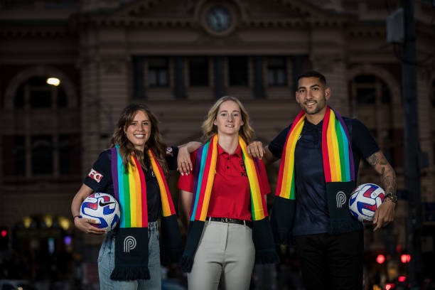 Melbourne Victory player Kayla Morrison, Adelaide United player Anne Grove and Melbourne Victory player George Timotheou pose for a photo during a...
