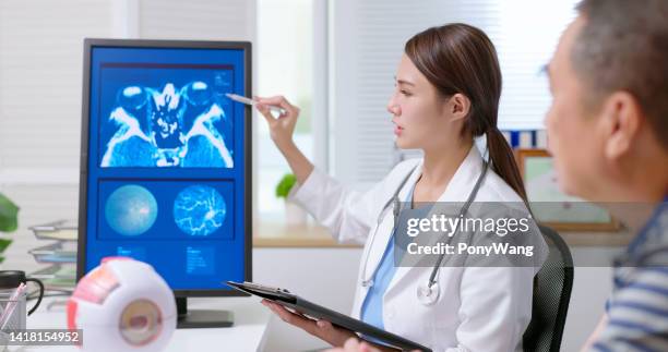 doctor explain eye xray film - color blindness stock pictures, royalty-free photos & images