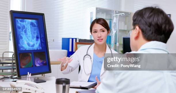 doctor explain colon xray - anal stock pictures, royalty-free photos & images