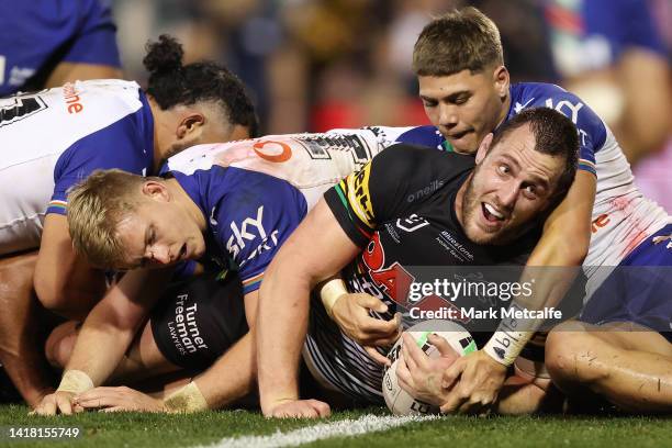 Isaah Yeo of the Panthers celebrates after scoring a try during the round 24 NRL match between the Penrith Panthers and the New Zealand Warriors at...