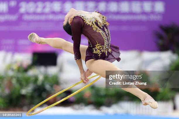 Zhang Yuhan of China competes with the hoop during the all-around final event of the rhythmic gymnastics on day four of the National Rhythmic...