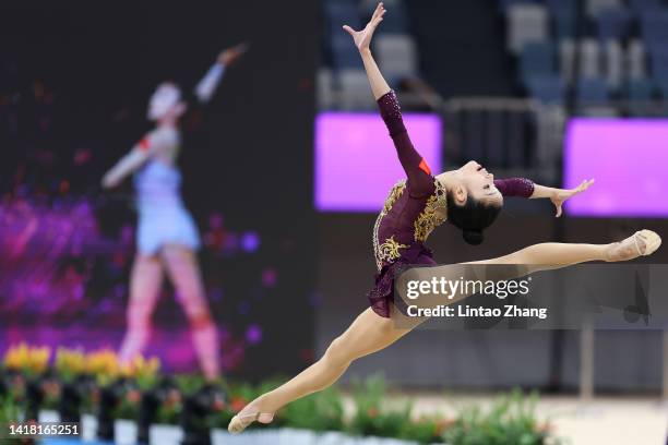 Zhang Yuhan of China competes with the hoop during the all-around final event of the rhythmic gymnastics on day four of the National Rhythmic...