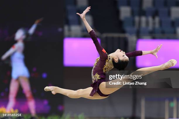 Zhang Yuhan of China competes with the hoop during the all-around final event of the rhythmic gymnastics on day four of the National Rhythmic...