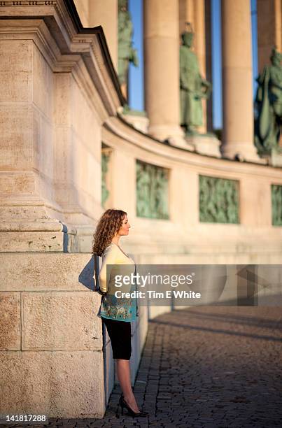 woman at heroes' square with the millennium memorial, budapest, hungary - fishermen's bastion stock pictures, royalty-free photos & images