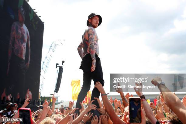 Frank Carter and The Rattlesnakes crowd surf during Reading Festival on August 26, 2022 in Reading, England.