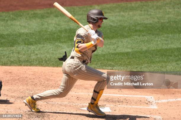 Jake Cronenworth of the San Diego Padres takes a swing during a baseball game against the Washington Nationals at Nationals Park on August 14, 2022...