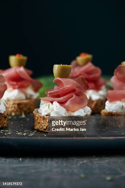sandwiches with cheese and smoked ham with olives - prosciutto stock pictures, royalty-free photos & images