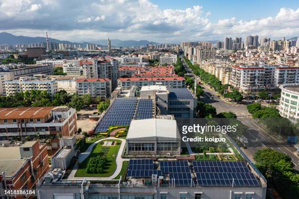 solar power plant under blue sky and white clouds - green roof stock pictures, royalty-free photos & images