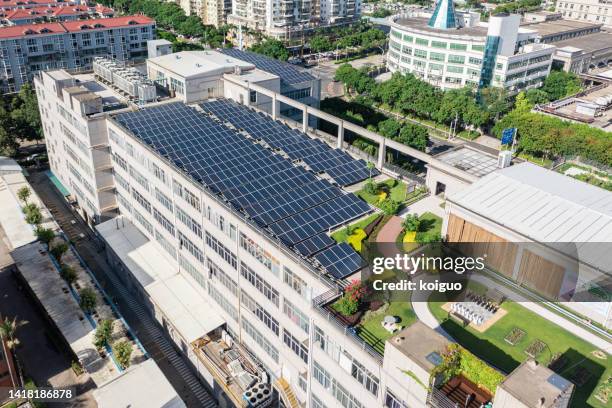 overhead shot of roof garden and solar panels - green roof stock pictures, royalty-free photos & images