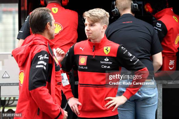 Robert Shwartzman of Israel and Ferrari, talks on the pitwall during practice ahead of the F1 Grand Prix of Belgium at Circuit de Spa-Francorchamps...