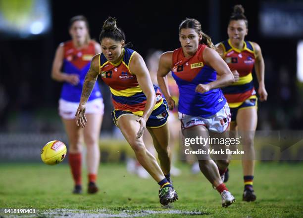 Stevie-Lee Thompson of the Adelaide Crows gets away from Eliza West of the Demons during the round one AFLW match between the Adelaide Crows and the...