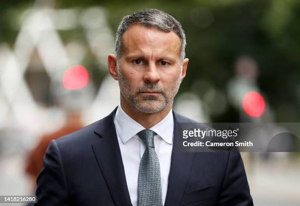 Ryan Giggs leaves Manchester Crown Court with his legal team on August 26, 2022 in Manchester, England. The former Manchester United midfielder and...