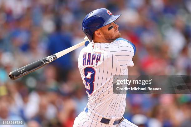Ian Happ of the Chicago Cubs hits a RBI double against the St. Louis Cardinals during the eighth inning at Wrigley Field on August 25, 2022 in...