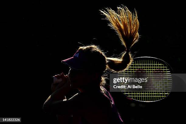 Maria Kirilenko of Russia playing with doubles partner Nadia Petrova of Russia returns a shot against Su Wei Hsieh of Chinese Taipai and Shuai Peng...