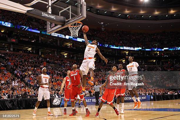 Dion Waiters of the Syracuse Orange goes to the hoop against Sam Thompson and Deshaun Thomas of the Ohio State Buckeyes during the 2012 NCAA Men's...