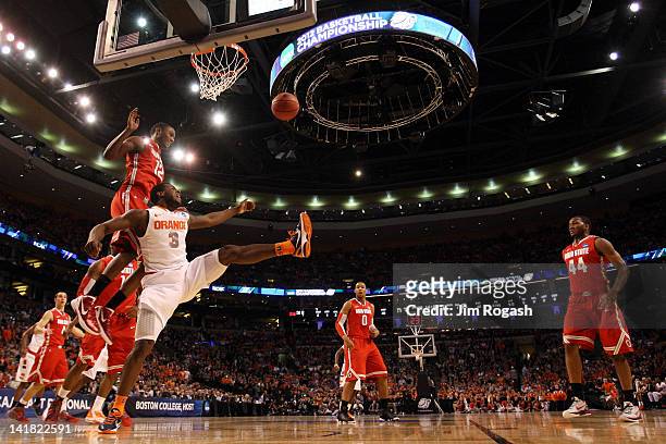 Sam Thompson of the Ohio State Buckeyes fights for the ball against Dion Waiters of the Syracuse Orange during the 2012 NCAA Men's Basketball East...
