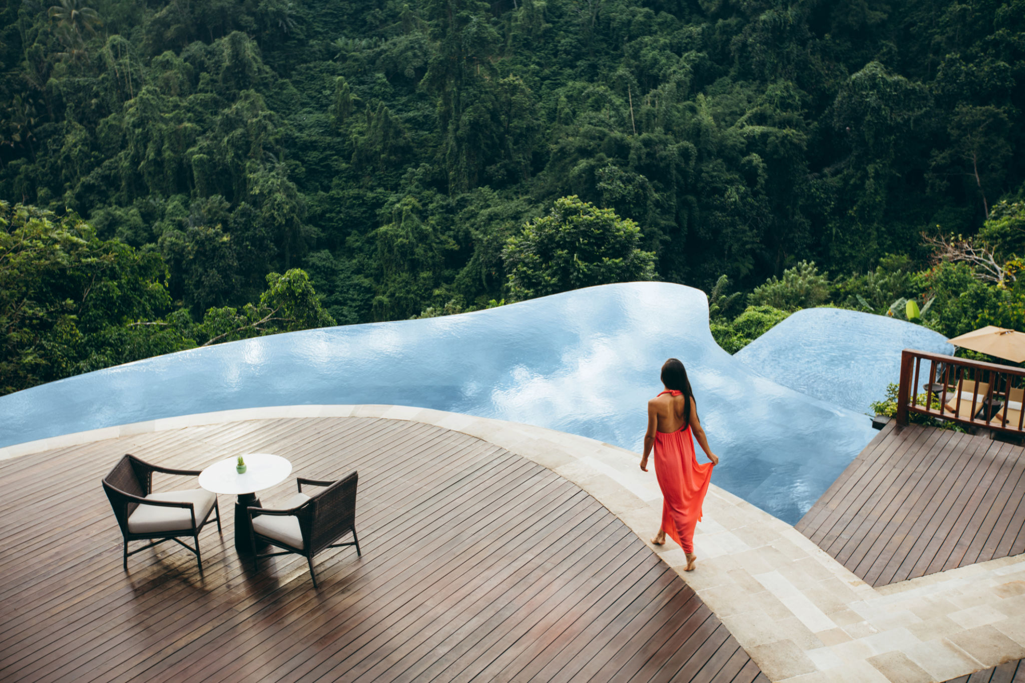 Woman at luxury resort poolside Woman at luxury resort poolside