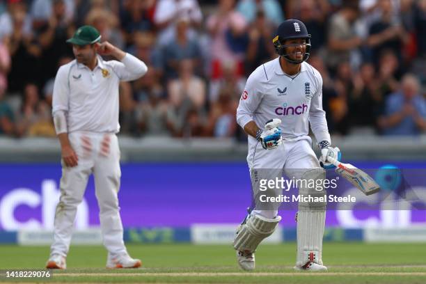 Ben Foakes of England reaches his century as South Africa captain Dean Elgar looks on during day two of the LV= Insurance 2nd Test match between...