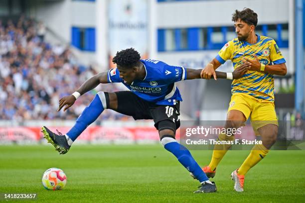 Immanuel Pherai of Braunschweig tackles Bryan Lasme of Bielefeld during the Second Bundesliga match between DSC Arminia Bielefeld and Eintracht...