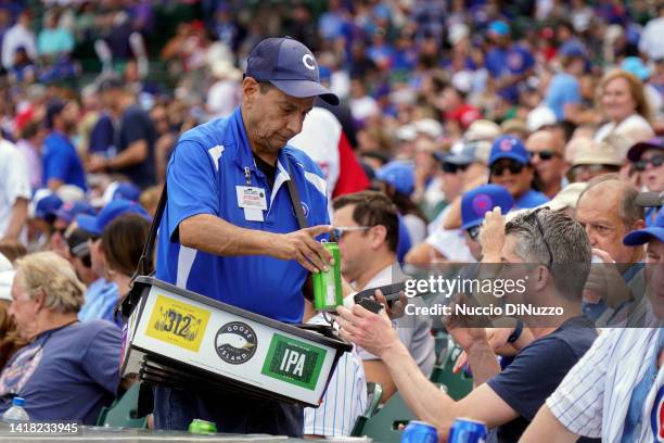 Long time beer vendor Rocco Caputo sells Goose Island products during a game between the Chicago Cubs and the St. Louis Cardinals at Wrigley Field on...