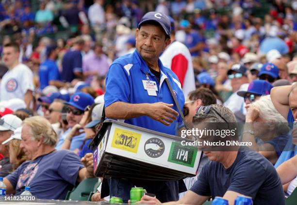 Long time beer vendor Rocco Caputo sells Goose Island products during a game between the Chicago Cubs and the St. Louis Cardinals at Wrigley Field on...