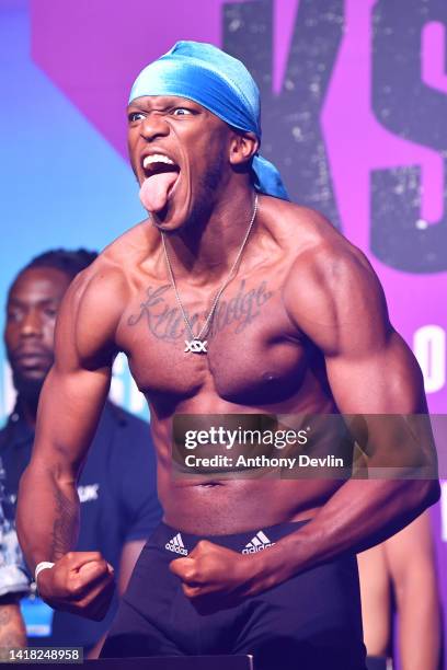 Poses on stage during his weigh-in ahead of his boxing match, on August 26, 2022 in London, England.