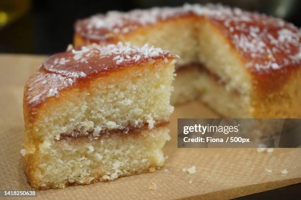 close-up of cake slice on cutting board - sponge cake stock pictures, royalty-free photos & images