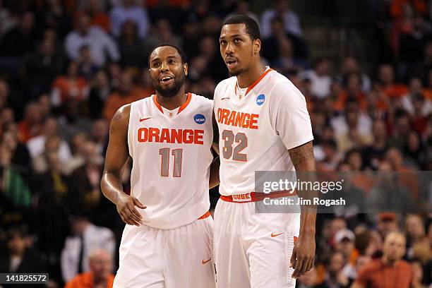 Scoop Jardine and Kris Joseph of the Syracuse Orange talk during a break in play against the Ohio State Buckeyes during the 2012 NCAA Men's...