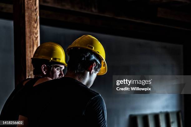 two night shift construction workers taking a break - laborer stock pictures, royalty-free photos & images