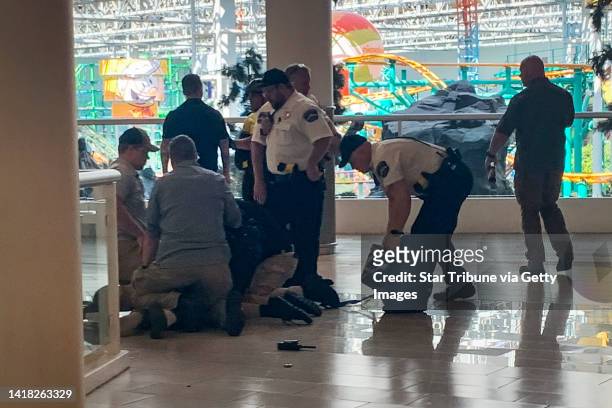 Man who was open carrying a weapon into the Mall of America was tackled and detained by authorities, Friday, August 26 Bloomington, Minn.
