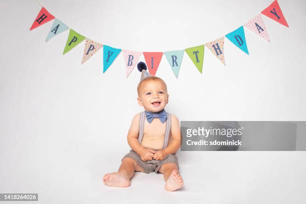 happy first birthday baby boy - eerste verjaardag stockfoto's en -beelden