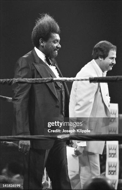 American boxing promotor Don King and an unidentified man in the ring during a Heavyweight Championship bout between American Muhammad Ali and...