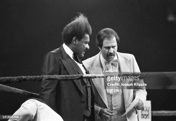 American boxing promotor Don King and an unidentified man in the ring during a Heavyweight Championship bout between American Muhammad Ali and...