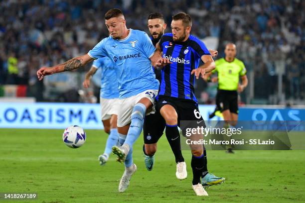 Sergej Milinkovic Savic of SS Lazio compete for the ball with Stefan De Vrij of FC Internazionale during the Serie A match between SS Lazio and FC...