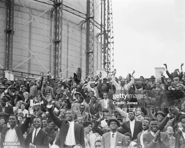 Cheers from West Indian spectators after an England wicket fell in their second innings of the 5th and final test match at the Oval in London, 24th...