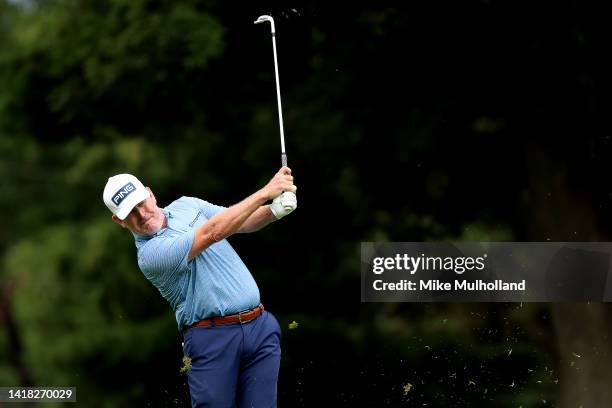 Jeff Maggert of the United States hits his approach shot on the first hoduring the first round of The Ally Challenge at Warwick Hills Golf And...