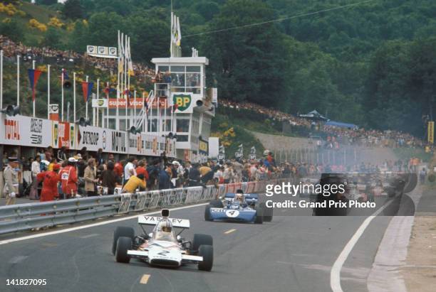 Denny Hulme of New Zealand drives the Yardley Team McLaren McLaren M19C Ford Cosworth V8 ahead of Jackie Stewart in the Elf Team Tyrrell Tyrrell 003...