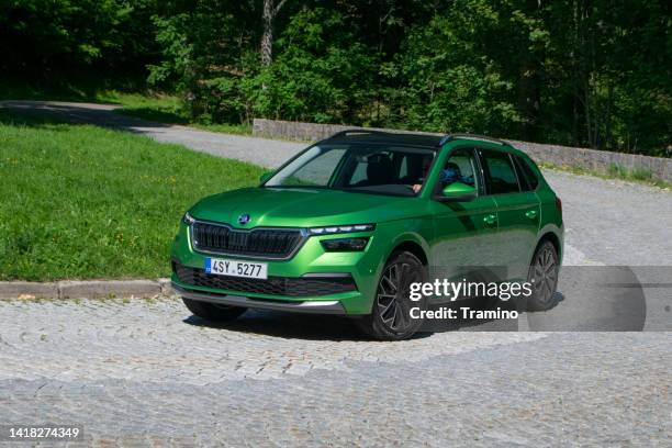 skoda kamiq on a road - škoda stockfoto's en -beelden